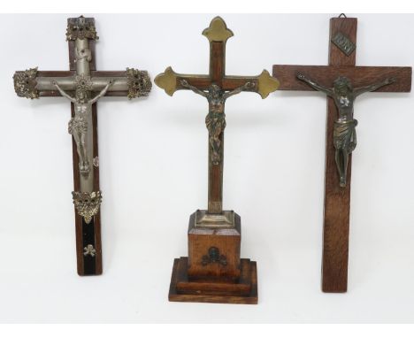 Three brass bound oak crucifixes, largest H: 31 cm. UK P&amp;P Group 2 (£20+VAT for the first lot and £4+VAT for subsequent l