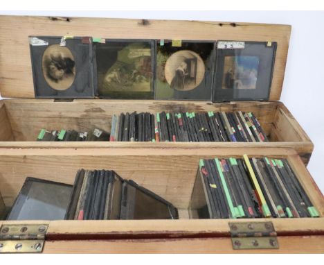 Approximately 200 magic lantern slides in two wooden case including portraits and paintings of animals. UK P&amp;P Group 3 (£