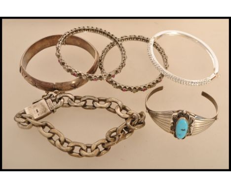 A group of sterling silver and other silver white metal jewellery to include a heavy silver curb link bracelet (96.5g) a ster