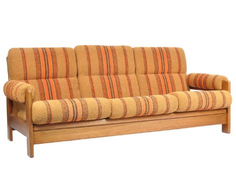 C. D. Pierce &amp; Son LTD - A retro vintage teak wood sofa daybed. The daybed comprising of a teak flat squared framed with 