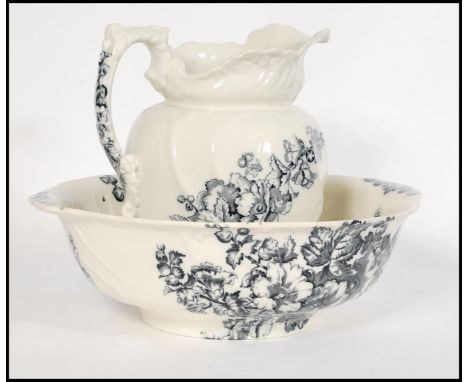 A Victorian ceramic washbowl and jug set in the ' Hollyhock ' pattern by S Bridgwood &amp; Sons. Marked to the base.&nbsp;Mea