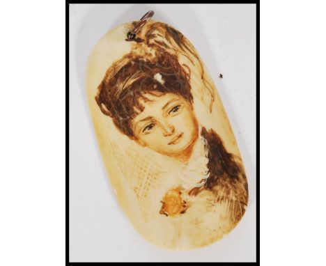 An early 20th century Marine Ivory Scrimshaw panel pendant having a painted portrait of a lady. Signed to verso W9 A Renoir'a