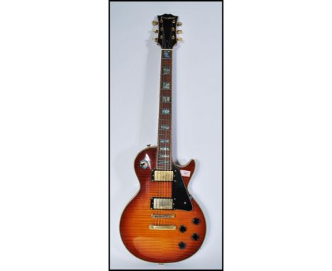 A vintage retro 20th century Westfield Gibson style electric guitar having sunburst body with abalone fret markers. Measures 