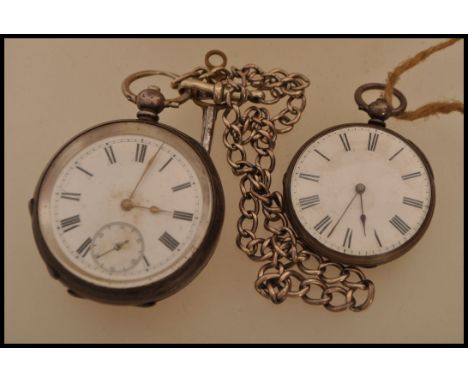 A Victorian 19th century silver hallmarked open faced pocket watch having roman numeral chapter ring with secondary dial. Hal