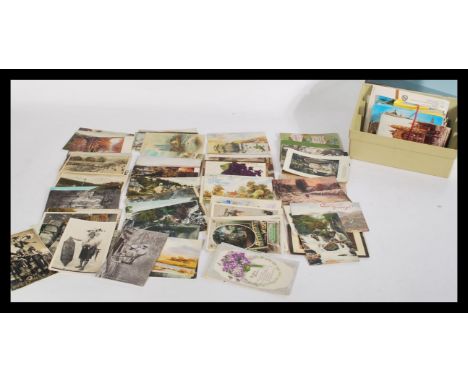 A good collection of vintage postcards dating from the early 20th Century, to include vistas, churches, architectural, tribal