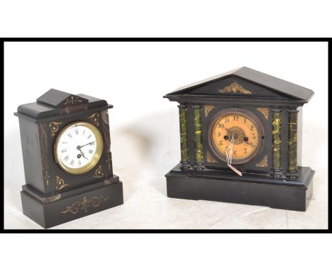 A 20th century slate mantel clock with with a central round enamelled face with roman numerals to the chapter ring and facete