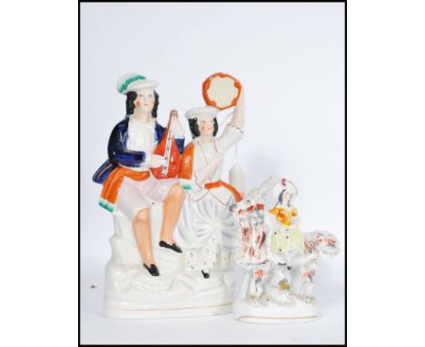 A Victorian Staffordshire flat back ceramic figurine of a goat and lady. Together with another ceramic flatback figurine depi