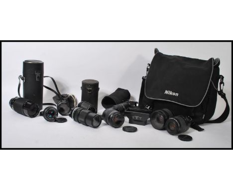 A collection of vintage 20th Century camera lenses to include a SMC Pentax 1:3.5, Vivitar Series 1 70-210mm Macro Focusing Zo