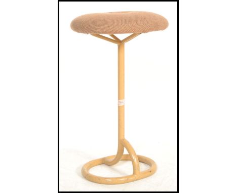 A vintage retro 20th century machinist stool raised on tubular base and supports with button upholstery seat.&nbsp;Measures: 