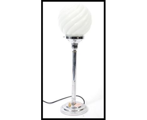 A art deco 1920's style chrome table lamp with original push button to circular stepped base with white glass cylindrical swi