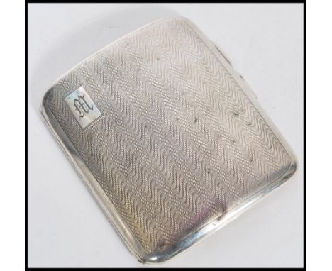A 1920's silver hallmarked cigarette case with an engine turned exterior. Hallmarked Birmingham 1929. Weight approx 67.7g. 8c