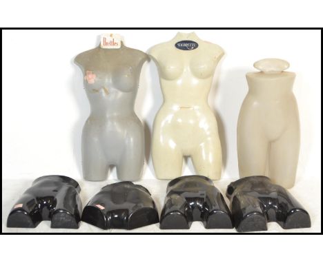 A collection of vintage 20th century shop - haberdashery table top / window display torso mannequins. Some with original make