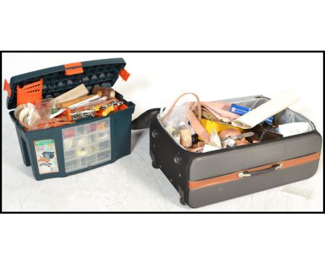 A good collection of leather working tools to include three trays of leather stamps of various designs, hole punctures, rivet