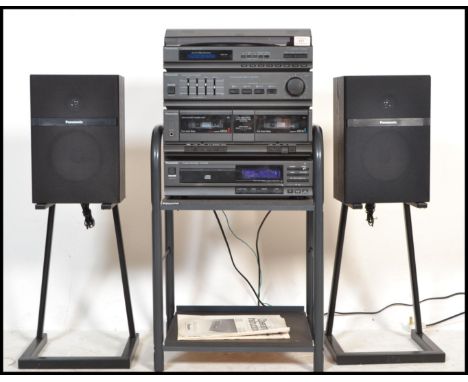 A 20th Century Panasonic stereo music system on stand, consisting of record deck, amplifier, radio receiver tuner, CD player 