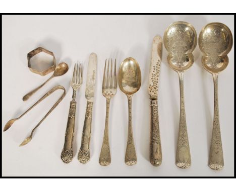 A group of silver hallmarked flatware daring from the 19th century to include a pair of London 1902 hallmarked serving spoons