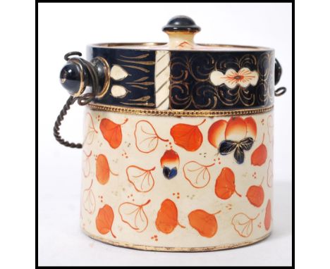 A 19th Century ceramic English Imari biscuit barrel / jar, having a twisted metal handle and finial lid.&nbsp;Measures 14cm-h