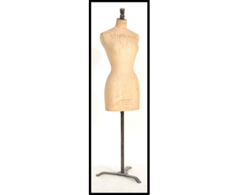 An early 20th century Stockman of Paris &amp; London tailors haberdashery dummy - mannequin ( number 40 ) being raised on tri