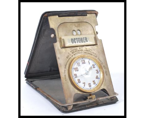 A fantastic vintage early 20th century travelling clock and desk calendar compendium featuring an A&amp;N.C.S.L. Goliath pock