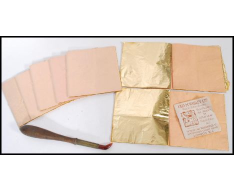 A collection of eight books of Gold leaf sheets together with with a tool for the application of gold leaf.&nbsp;Measures 23c
