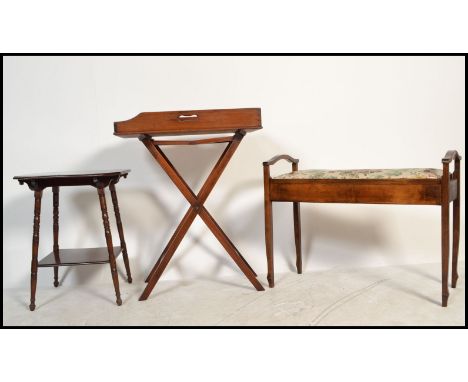 An Edwardian mahogany duet piano stool together with a butlers mahogany folding tray and an Edwardian mahogany lamp table.