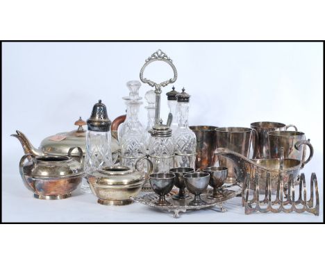 A collection of vintage silver plated wares to include various silver plate flatware and cutlery, cruet set, table lighter, s