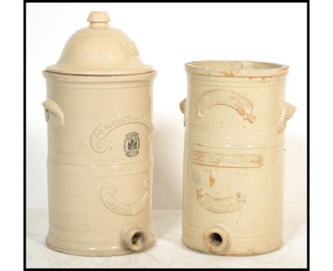 2 Victorian large ceramic water filters of cylindrical form to include a Howells Improved Water Filter with lid along with an