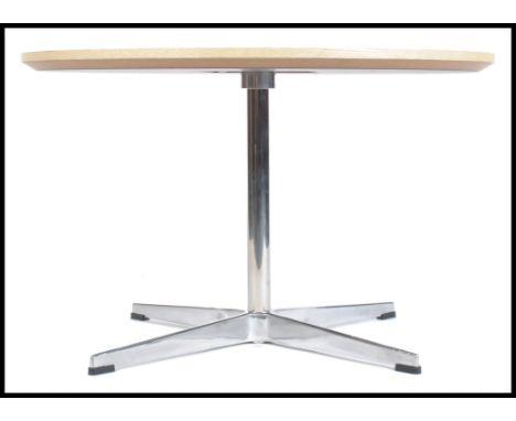 After Arne Jacobsen - Egg Table - A contemporary white topped round side / coffee / lamp table. The table having a wooden and