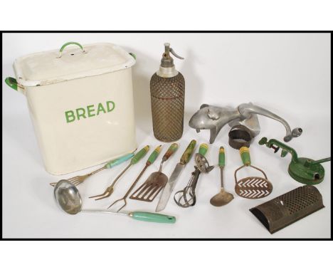 A collection of vintage 20th Century kitchenalia items to include an enamel bread bin and lid with green notation to the fron