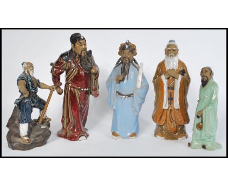 A group of five 20th century Oriental Chinese and Japanese pottery and ceramic figurines of elders.&nbsp;Measures 33cm-high.
