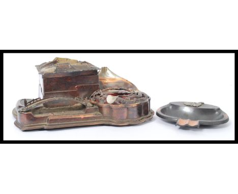 A vintage early 20th century Japanese musical matchbox ashtray match striker along with a similar example depicting a man pla