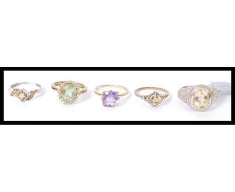 A selection of ladies fashion rings to include a Sheffield hallmarked 9ct gold ring set with a square cut purple stone (size 