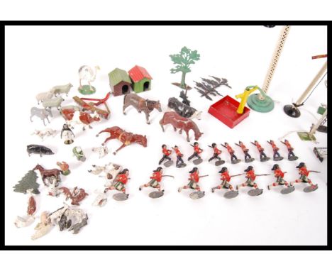 A collection of assorted vintage Britain's lead model figures to include; farm animals , highlanders , British soldiers&nbsp;