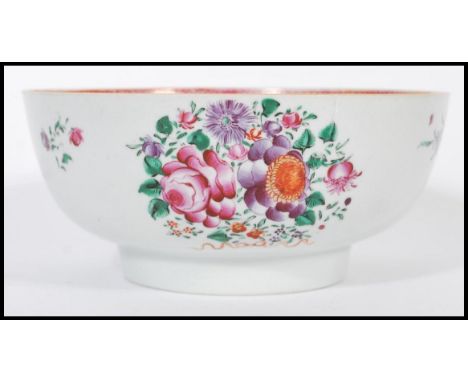 An 18th century Cantonese large Chinese ceramic bowl having hand painted floral sprays and famille rose border. The large bow