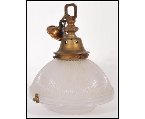 A mid 20th century vintage retro fluted glass ceiling pendant light shade, with brass fittings having pierced decoration. 32c