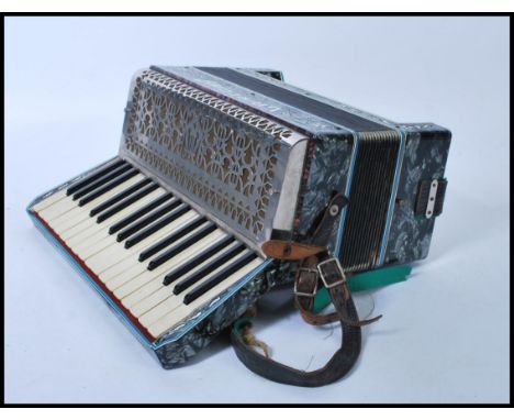 Musical Instruments: A vintage cased 20th Century Accordion, makers mark for La Regina Italia.