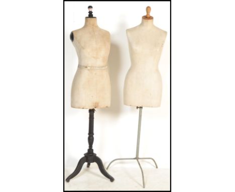 Two vintage early 20th century shop display haberdashery dress makers mannequins raised on wooden bases with adjustable manne