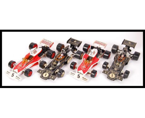 A collection of 4 x assorted Corgi precision 1:18 scale diecast model F1 formula one racing cars to include 2 x John Player S