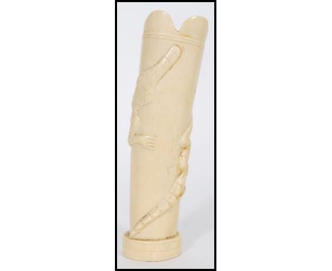 An early 20th century Ivory vase having relief decoration of alligators / crocodiles with scalloped ring. Measures 18cm high 