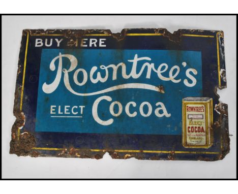 A vintage early 20th Century enamel point of sale Industrial advertising sign for Rowntree's, the sign on a two tone blue gro