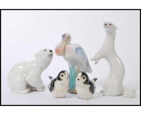 A group of vintage USSR ceramic figures to include polar bear, weasel etc. Along with other ceramic figures.&nbsp;Measures 18