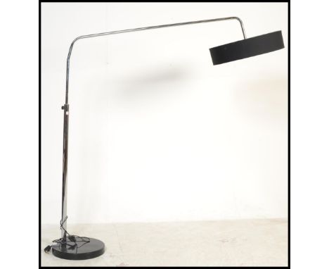 A vintage 20th century tubular angled lamp raised on a black marble circular base with adjustable tubular supports.