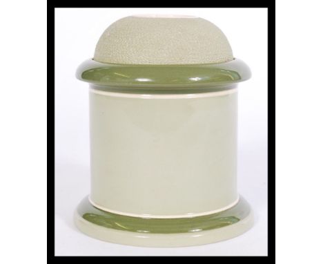 A vintage 20th century Carlton Ware tobacco jar having an unusual interior lid numbered 370813, having a domed textured match