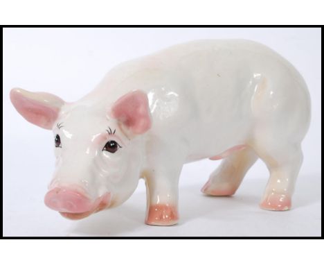 A vintage 20th century advertising point of sale Butchers shop window large ceramic model of a pig. The pig modelled standing