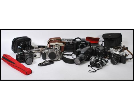 A large collection of vintage camera's to include Zenit E SLR, Praktica SLR, Lumix, Olympus, Nikon, Canon, Kodak etc. Some wi