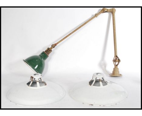 A vintage 1940's Dugdills engineers lamp, articulated tubular iron frame, with original paint work and green enamelled shade 