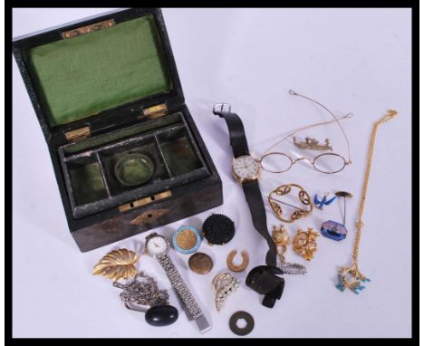 A collection of costume jewellery to include a Scandinavian / Danish enamel brooch, Ingersol watch, brooches etc, all contain