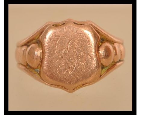 An 20th hallmark 9ct signet gentlemans gold ring. Hallmark Chester '' N '' 375 makers initials J H weight 3.7 grams. Size R.5