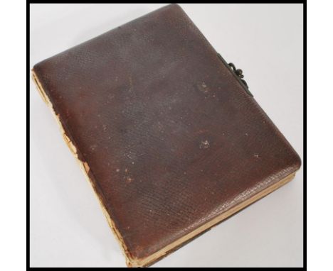 A 19th century Victorian album of Cdvs portrait photographs. The family album containing mostly named photos held within leat