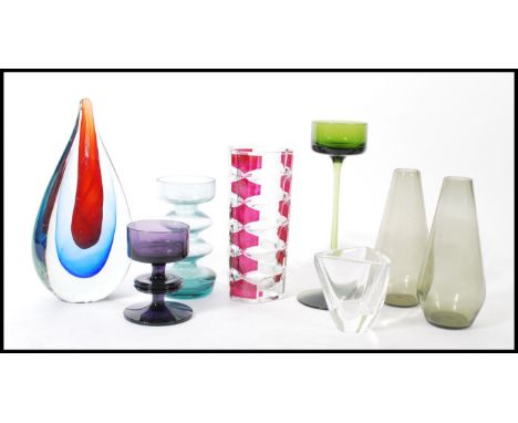 A group of vintage retro 20th century studio art glass to include a cased rain drop shaped vase, tall wine glass with thin st