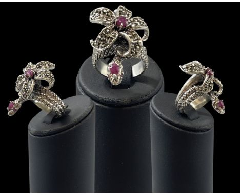 Unusual silver marcasite and ruby snake and flower style ring, weight 12.10 grams, size N